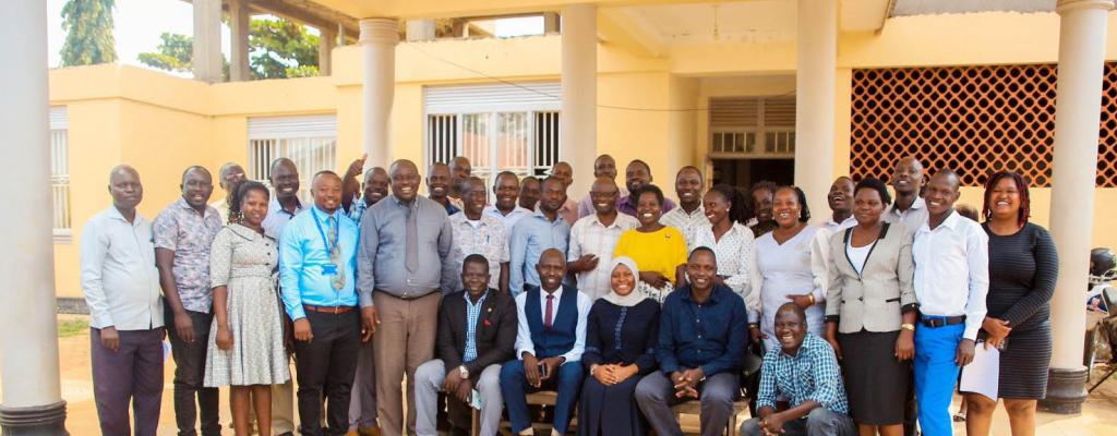 #htmlcaption-5 The Permanent Secretary for the Ministry of ICT & National Guidance, Dr. Aminah Zawedde, putting on the hijab